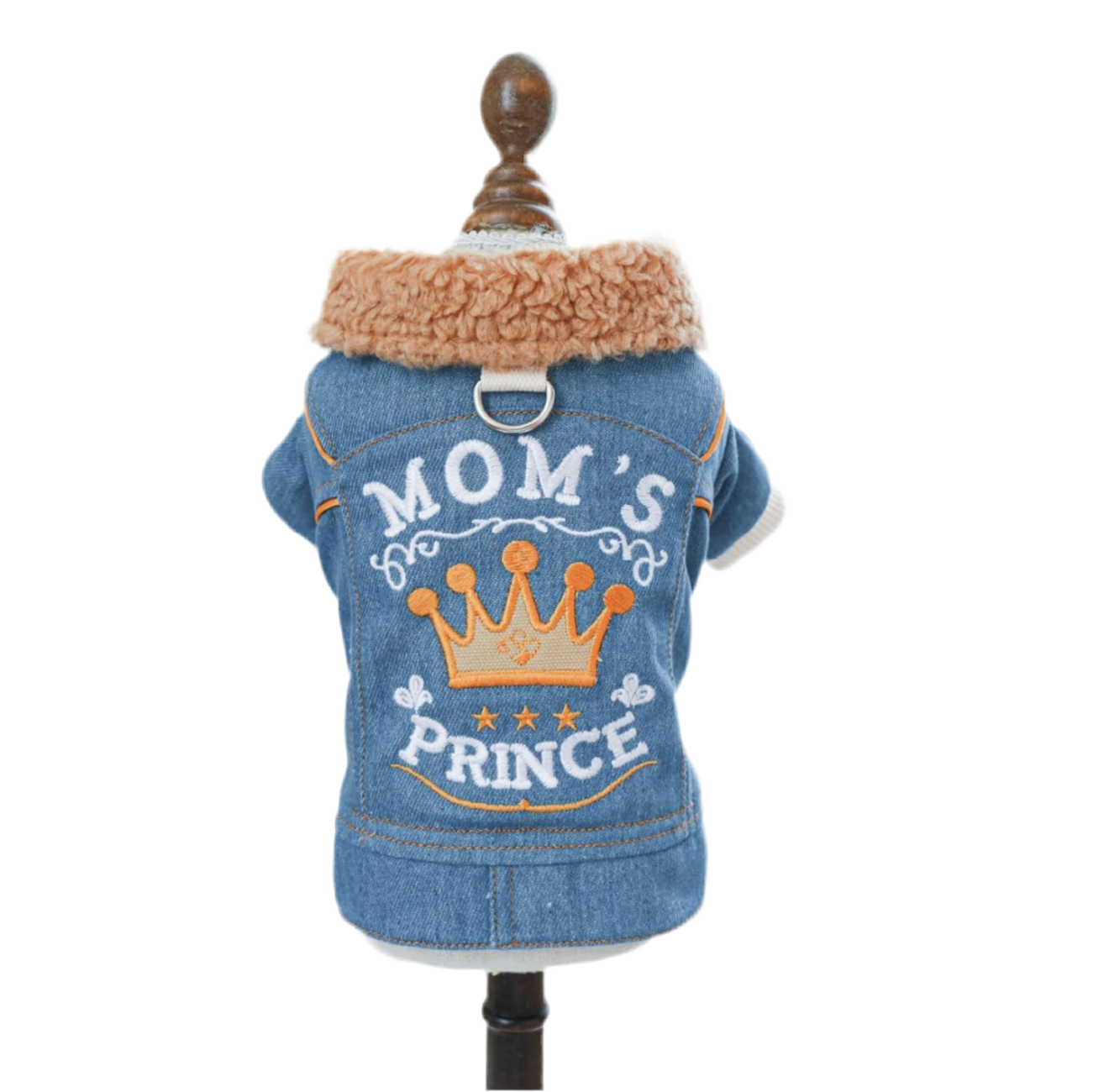A denim jacket for pets with 'MOM'S PRINCE' printed on the back, featuring a crown graphic and a brown fleece lining.