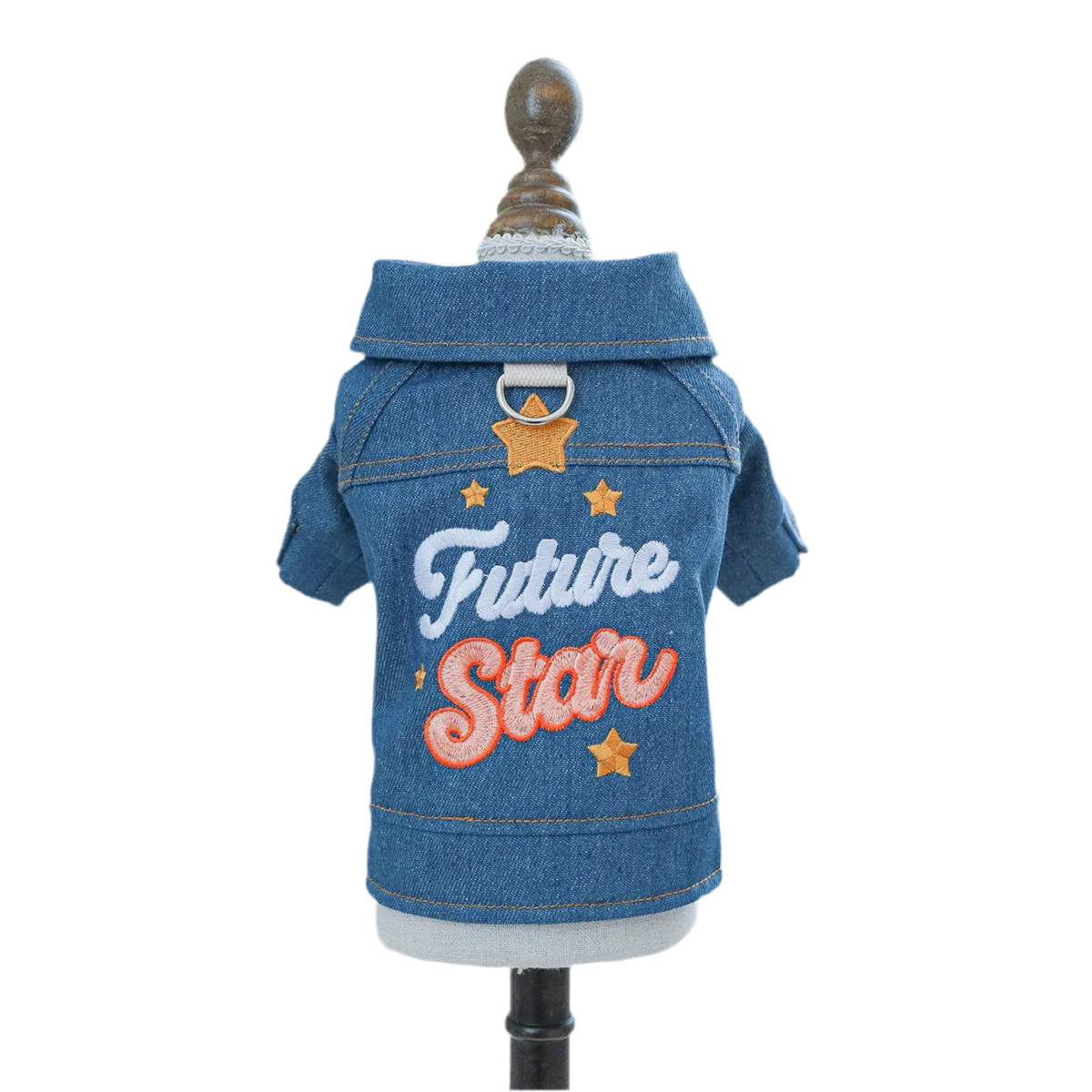 A denim jacket for dogs displayed on a mannequin, featuring the text 'Future Star' on the back with star decorations.