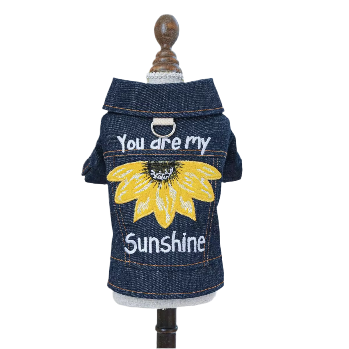 A denim jacket for dogs displayed on a mannequin with the text 'You are my Sunshine' and a sunflower graphic on the back.