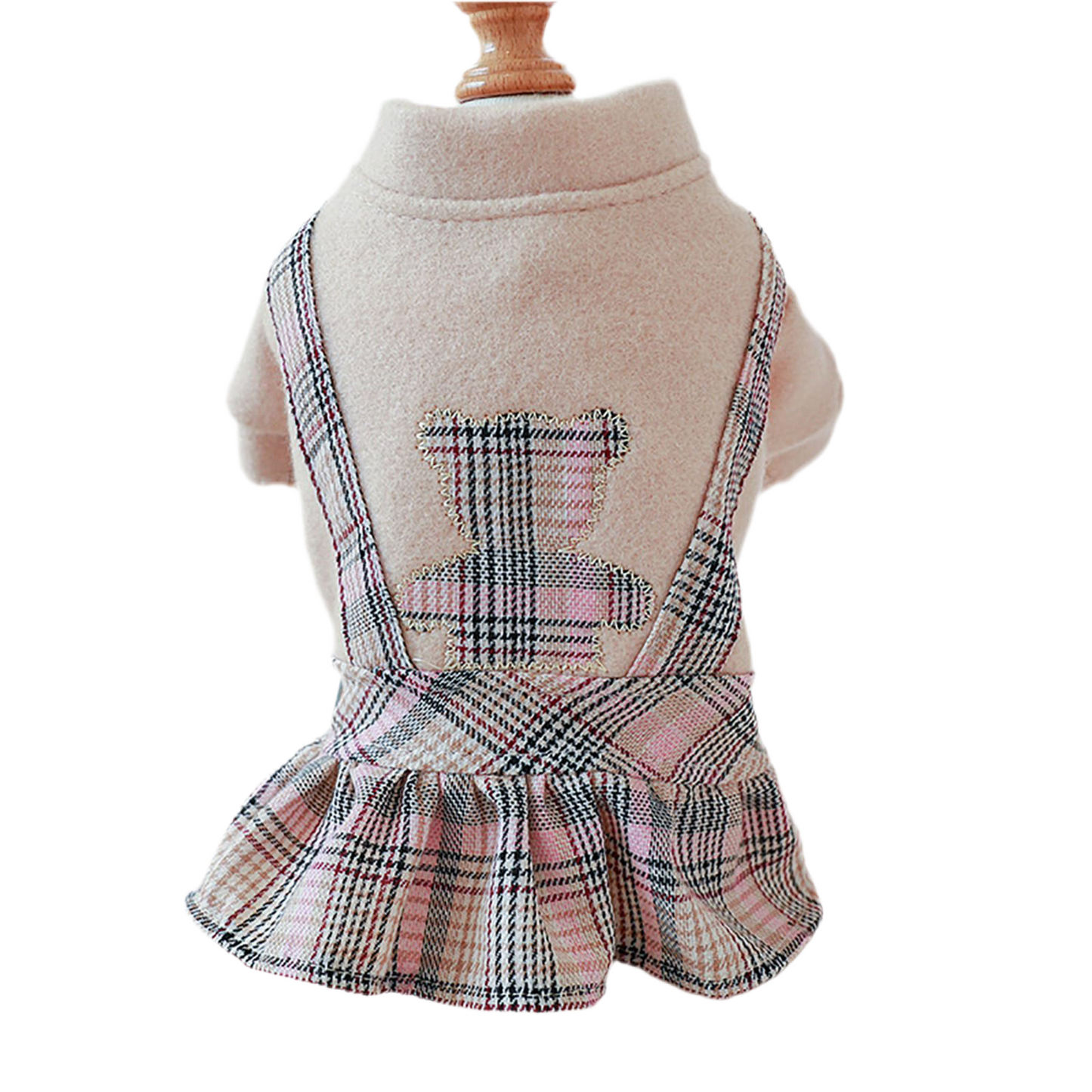 A blush bear-shaped pet dress with checkered pattern on a mannequin.